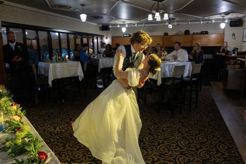 Groom dipping the bride during their first dance